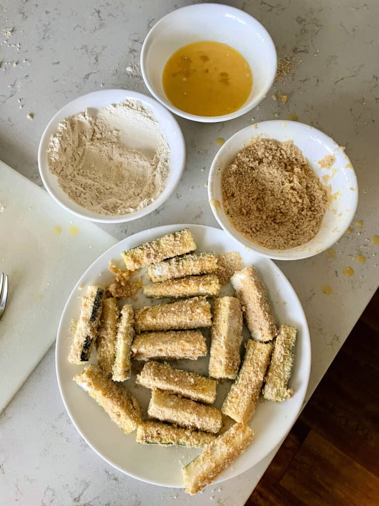 zucchini sticks breaded and ready to be air fried