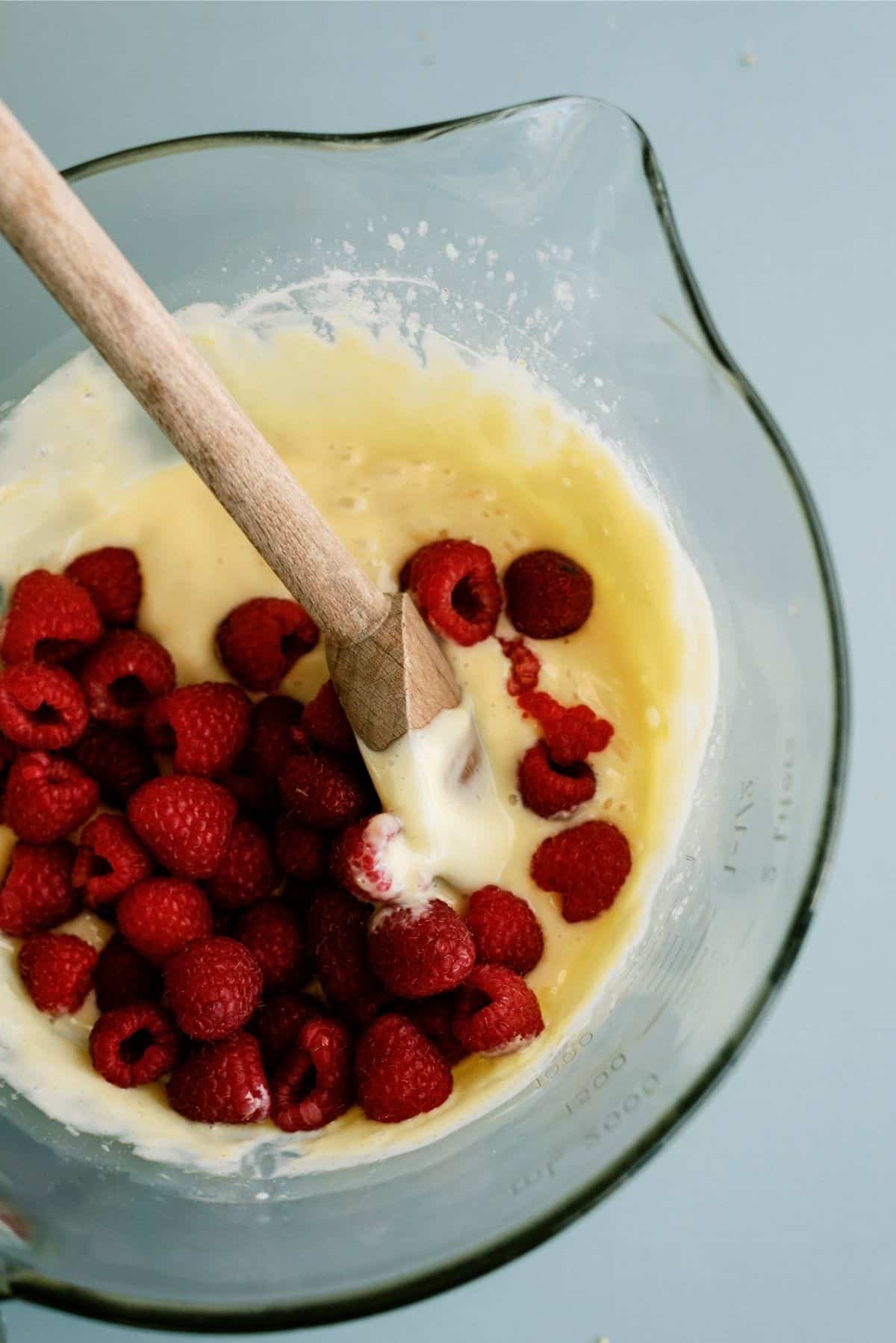 Adding raspberries to Lemon Mixture for Lemon Raspberry Bars