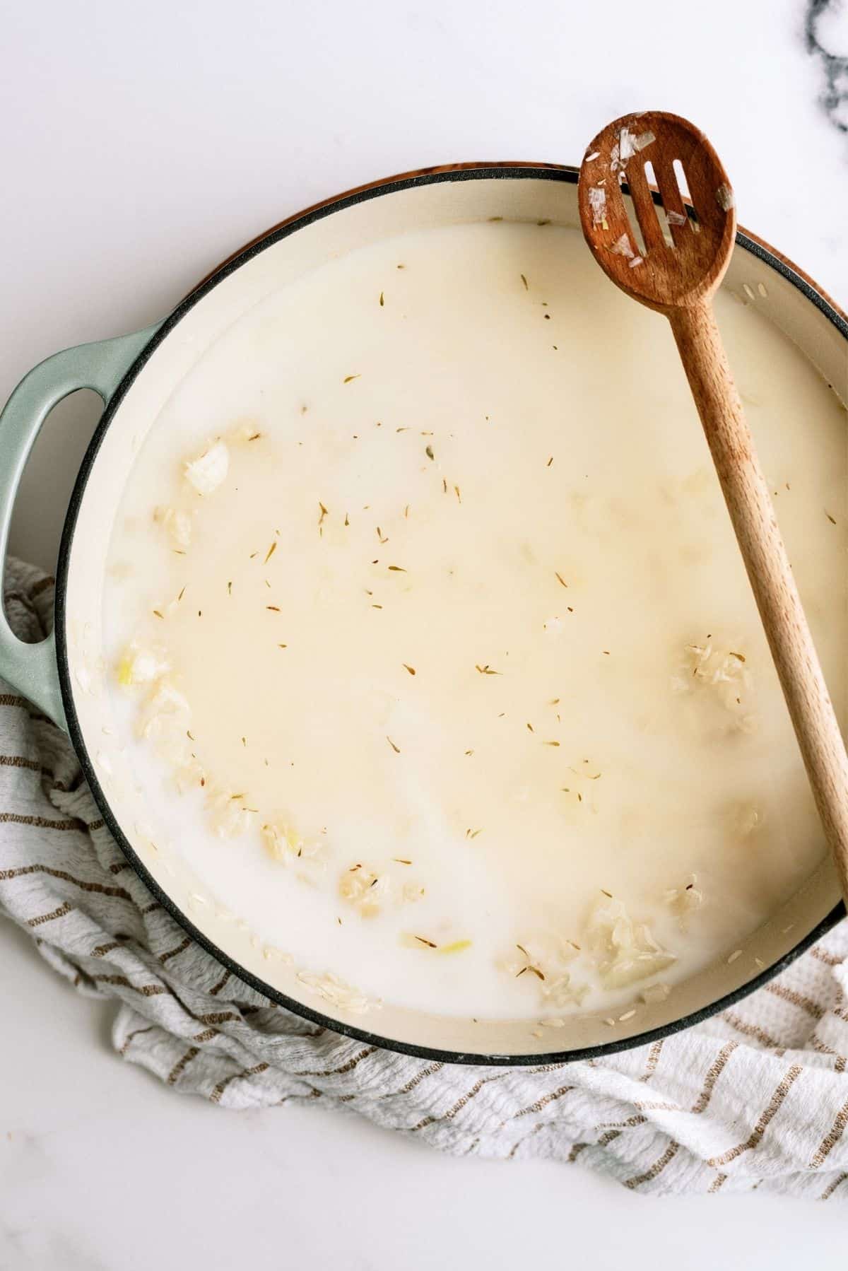 All ingredients in pot for Creamy Chicken and Rice Casserole Skillet