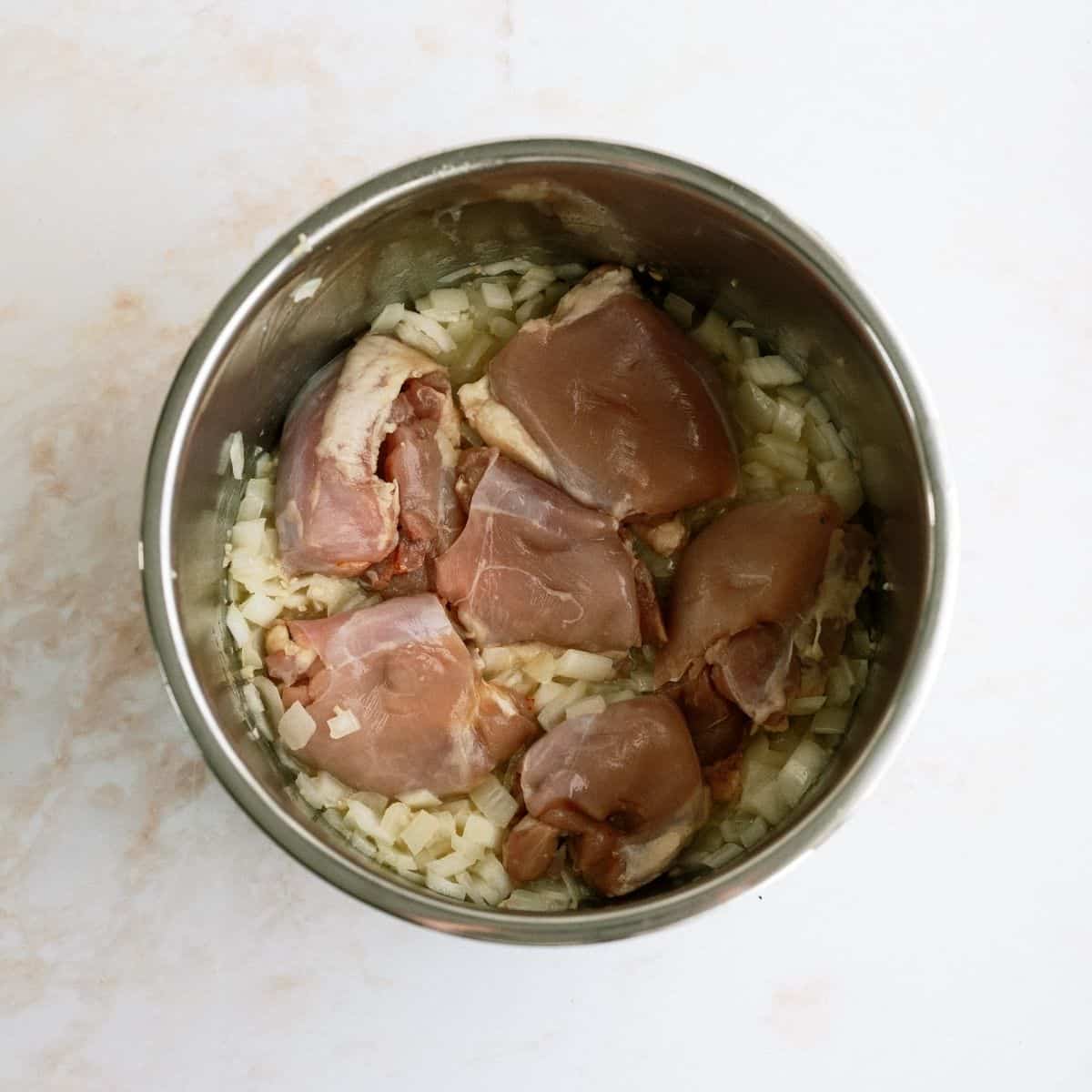 Chicken Thigh Pieces Onions and Butter in Instant Pot