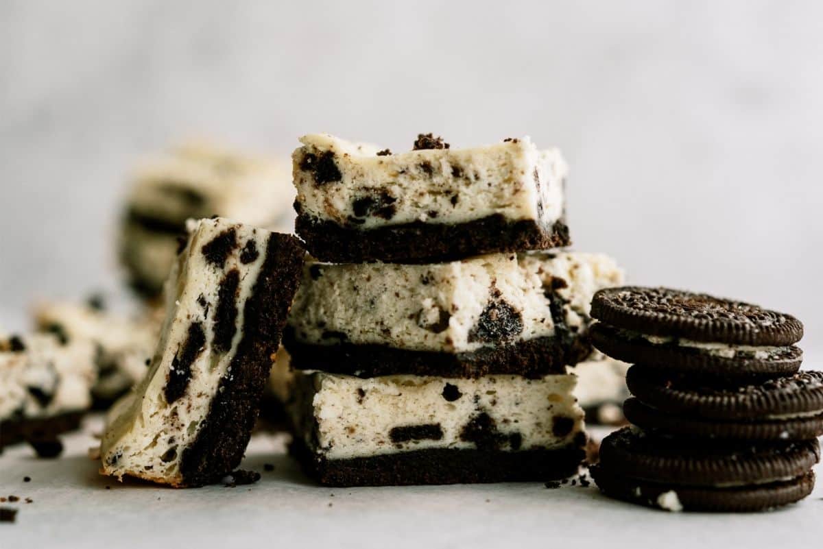 Cookies and Cream Cheesecake Bars sliced with Oreos
