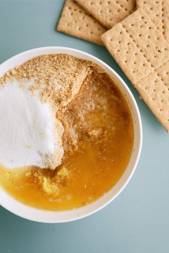 Graham cracker mixture in a mixing bowl.