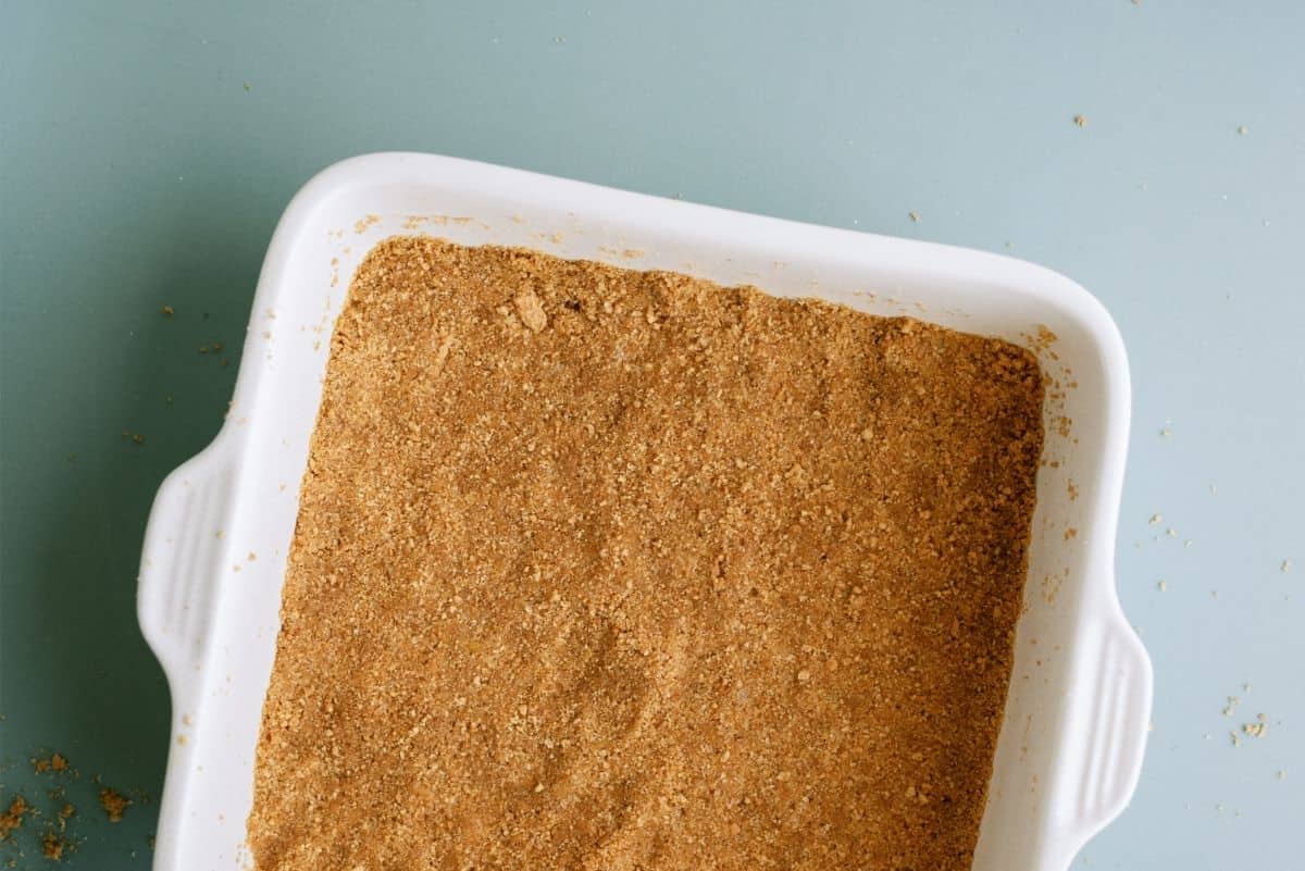 Graham Cracker mixture pressed into an 8x8 pan