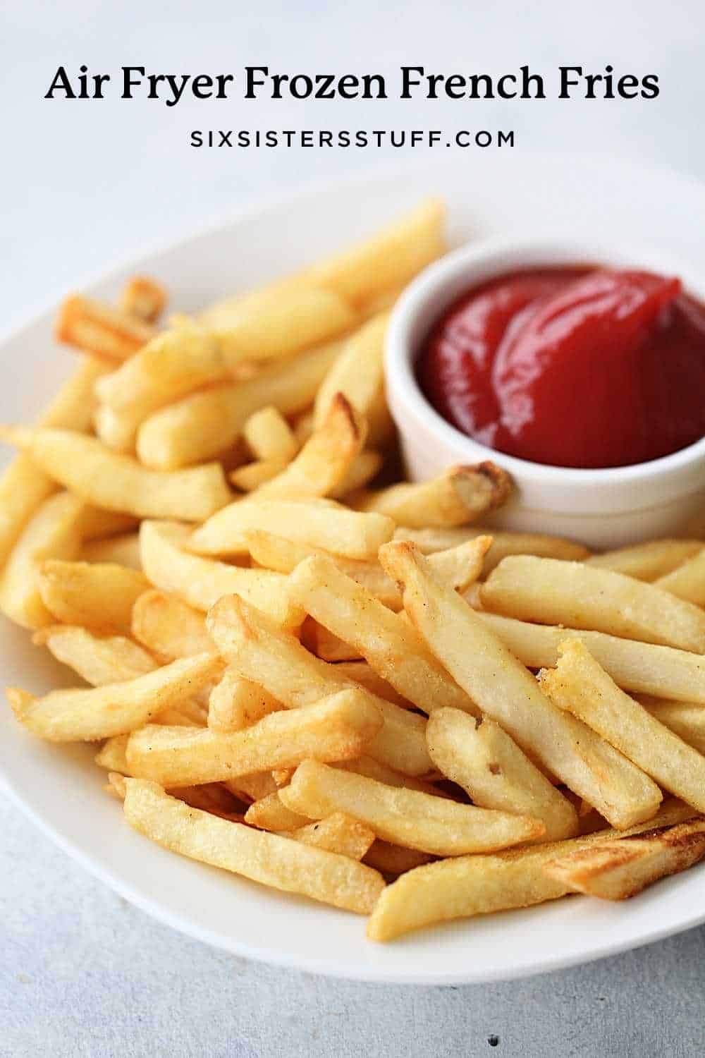 french fries that have been cooked in the air fryer with ketchup on the side