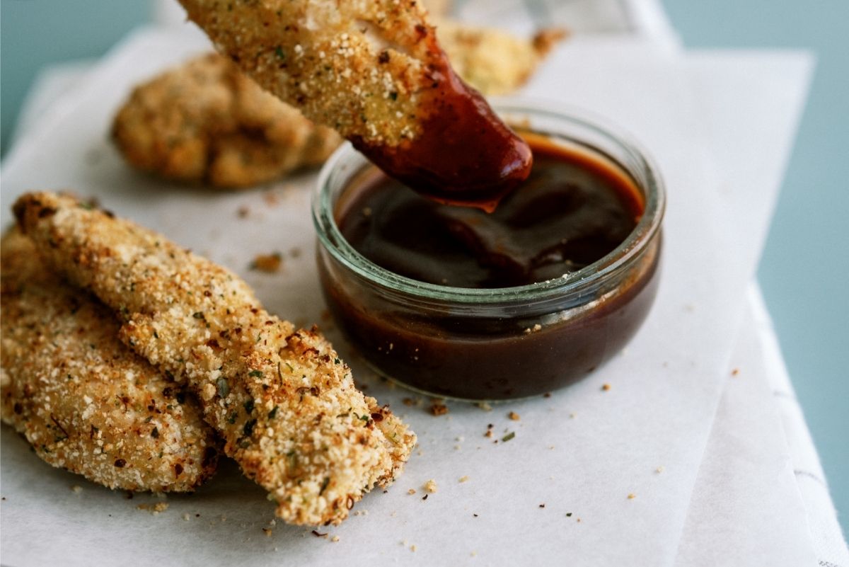 Instant Pot Air Fryer Chicken Tenders dipped in BBQ Sauce