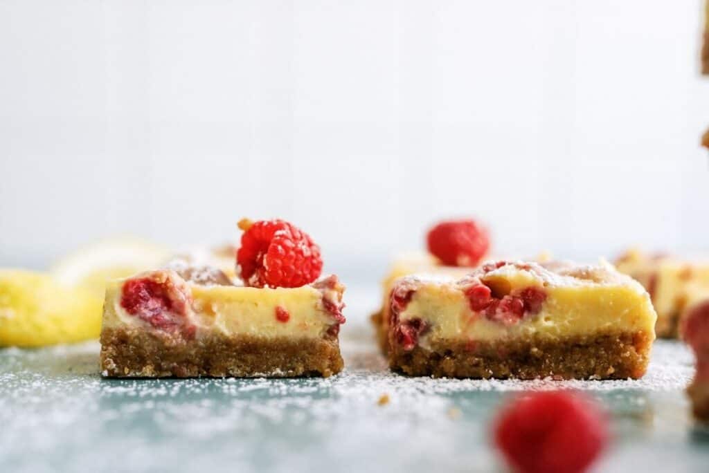 Side view of Lemon Raspberry Bars cut into squares.