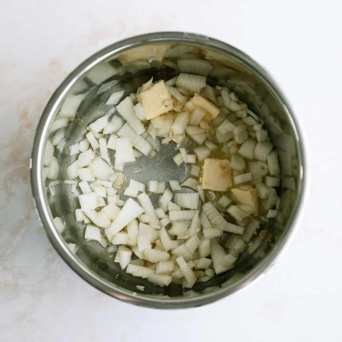 Onions and Butter in the bottom of an instant pot