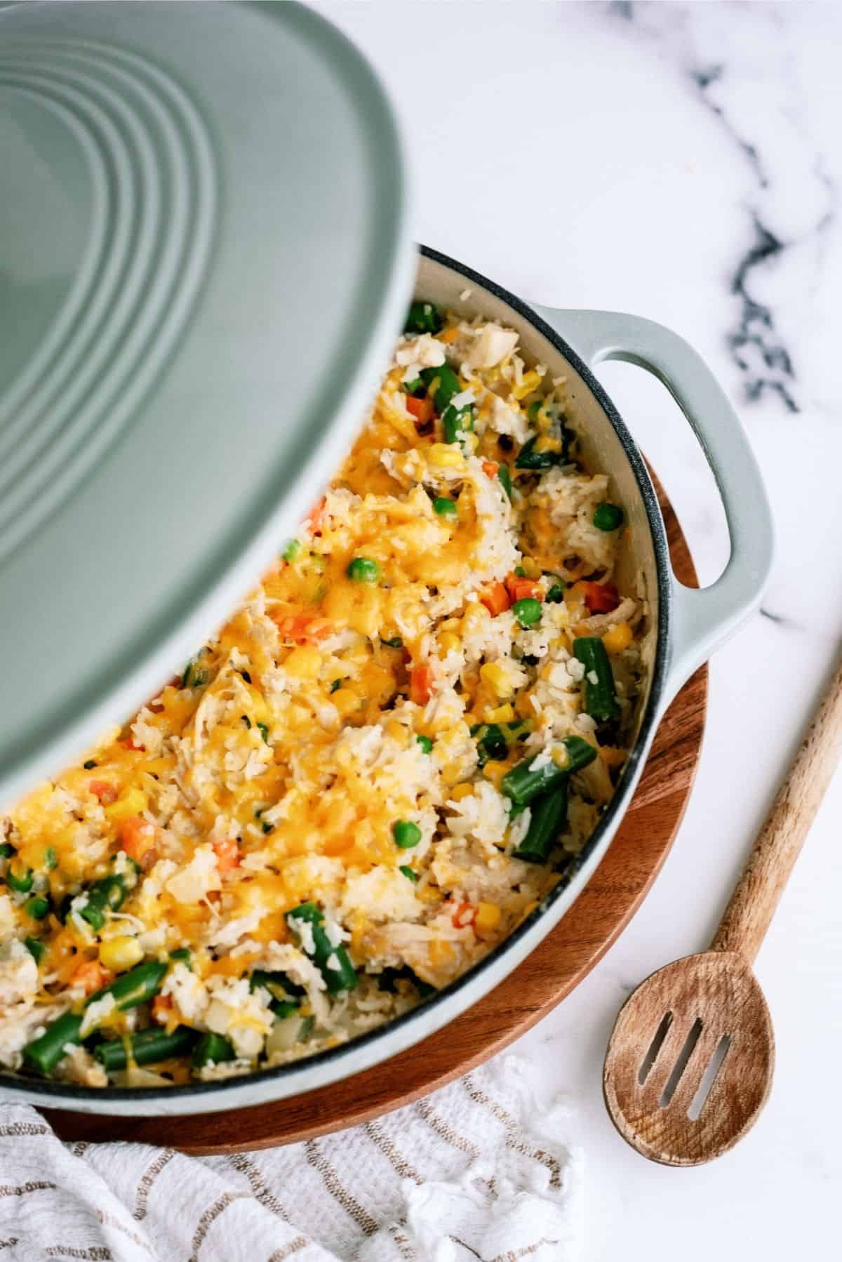 Place lid on pot to melt cheese for Creamy Chicken and Rice Casserole Skillet