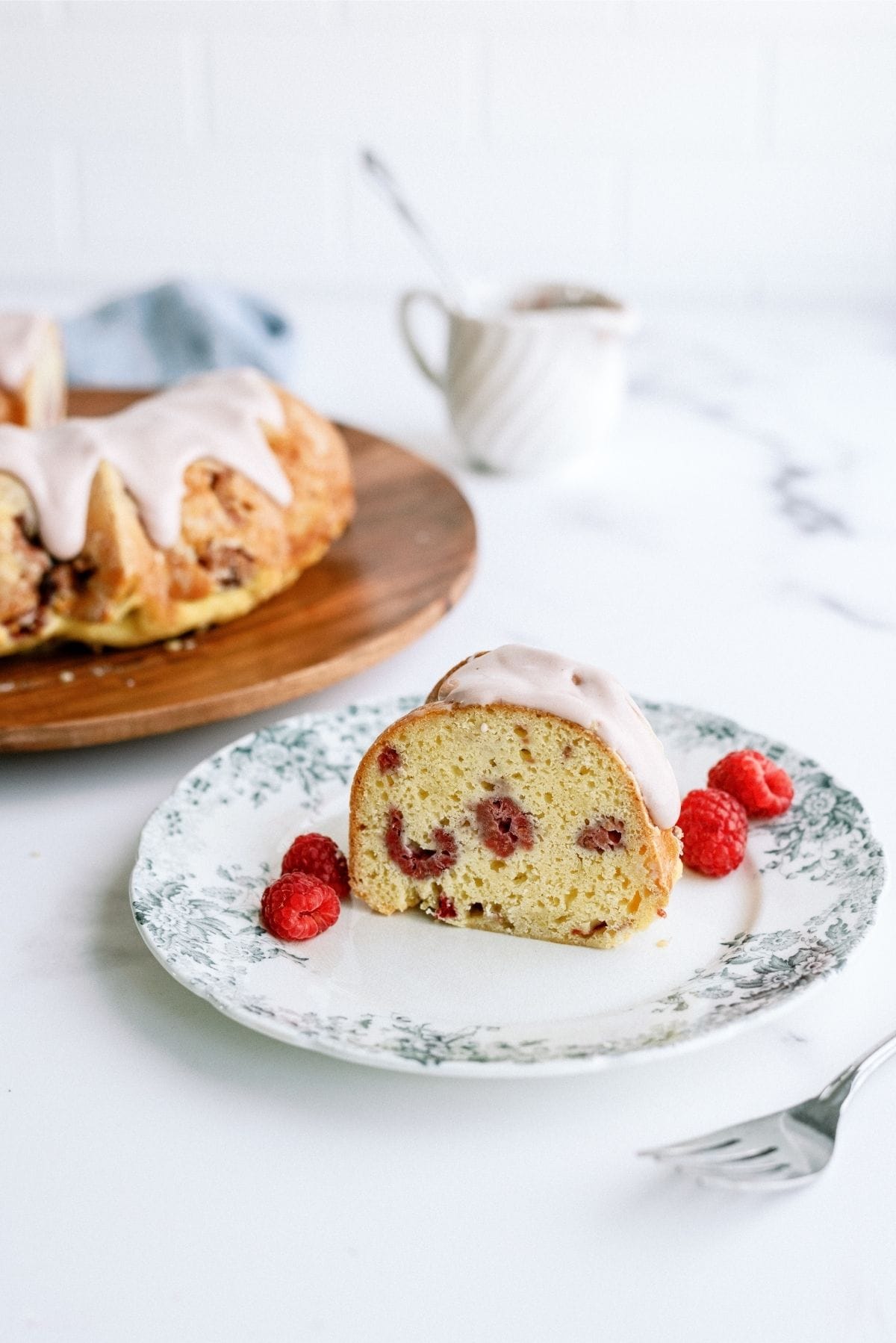 Slice of Fresh Raspberry Yogurt Bundt Cake on a plate