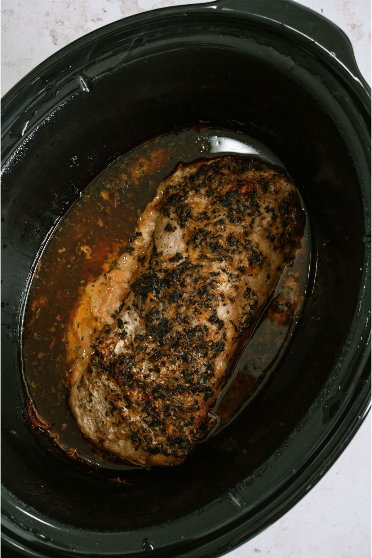 Slow Cooker Parmesan Honey Pork Roast in the slow cooker.