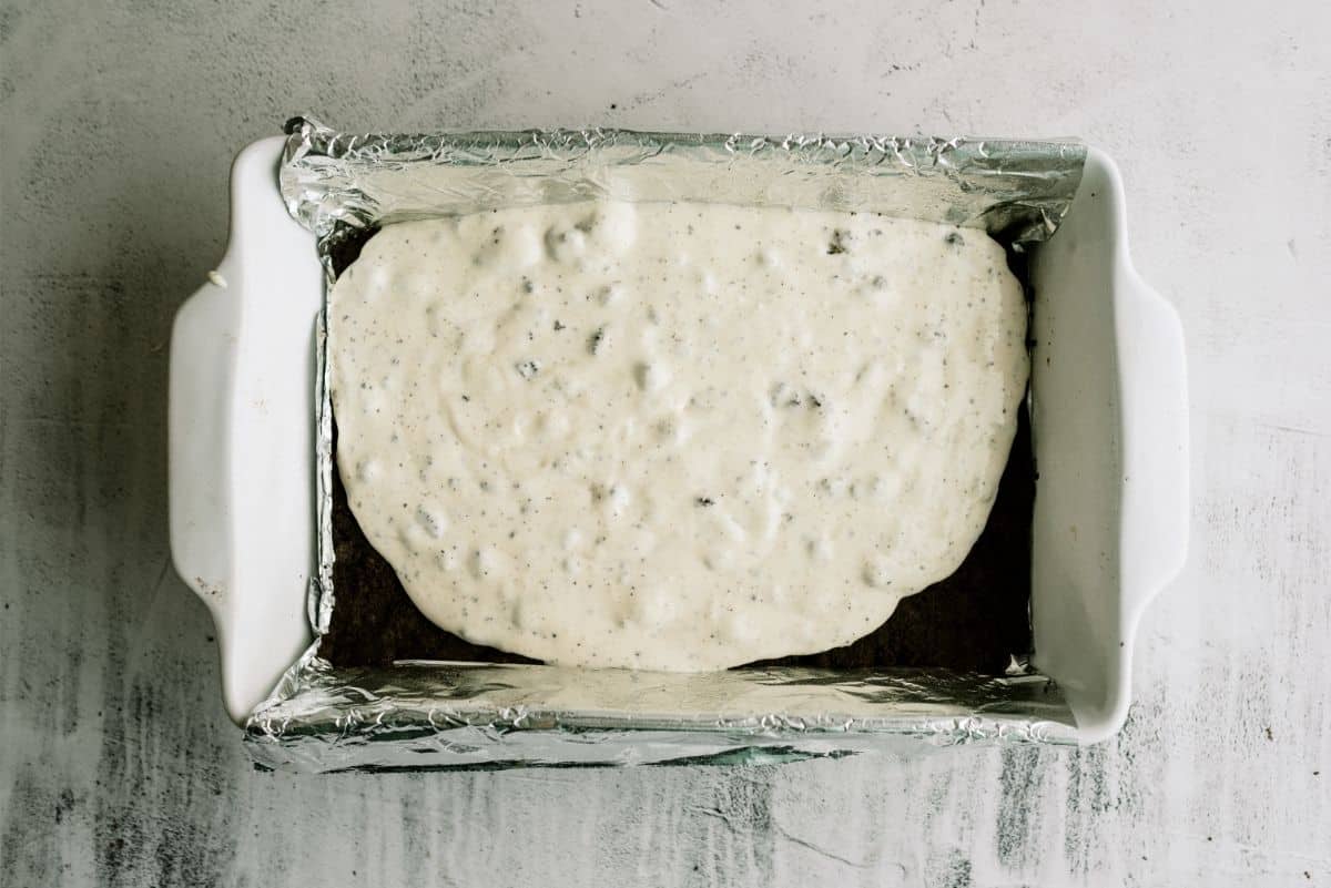 Spread cream cheese mixture over oreo crust