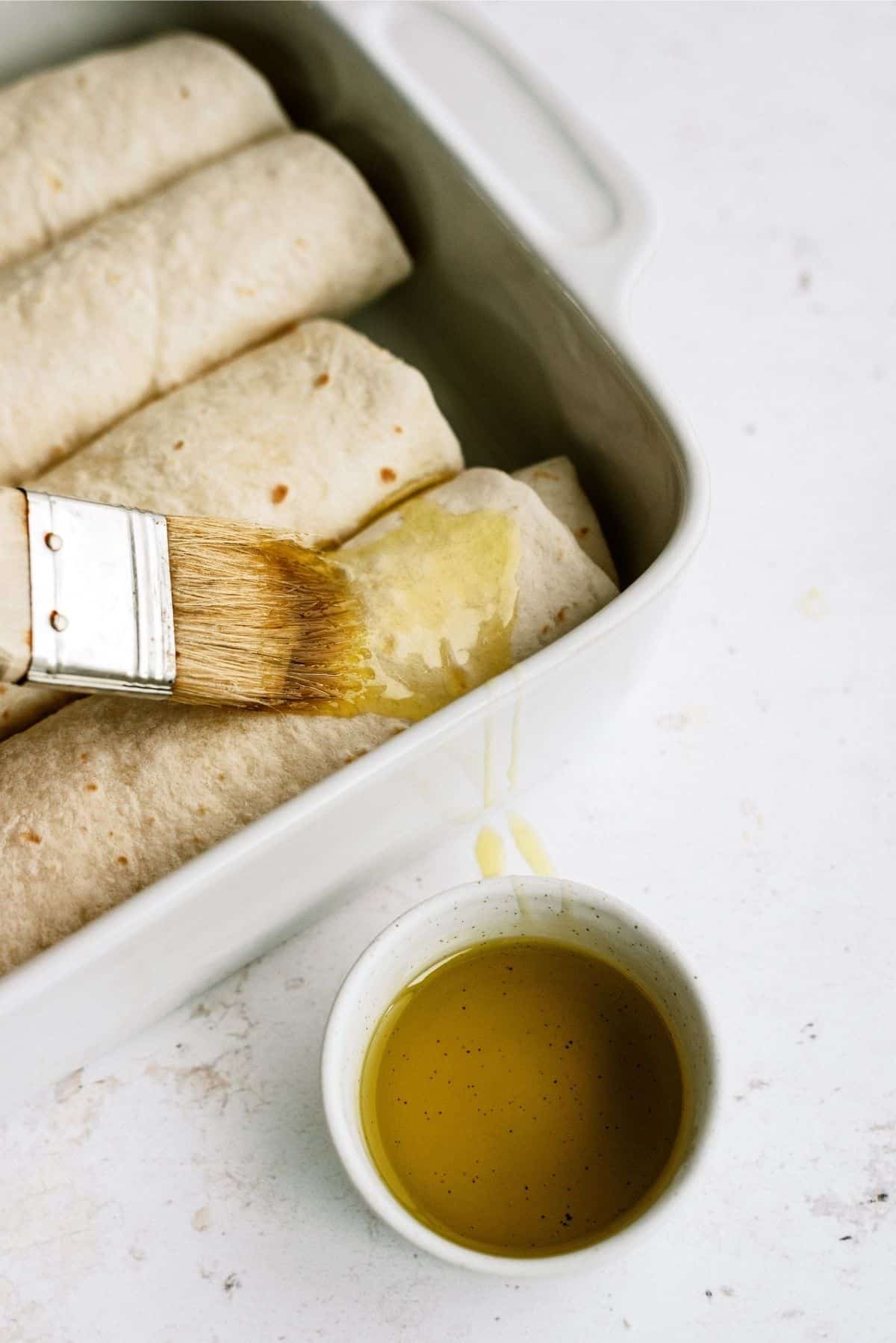 Unbaked Chimichangas with brushed on olive oil