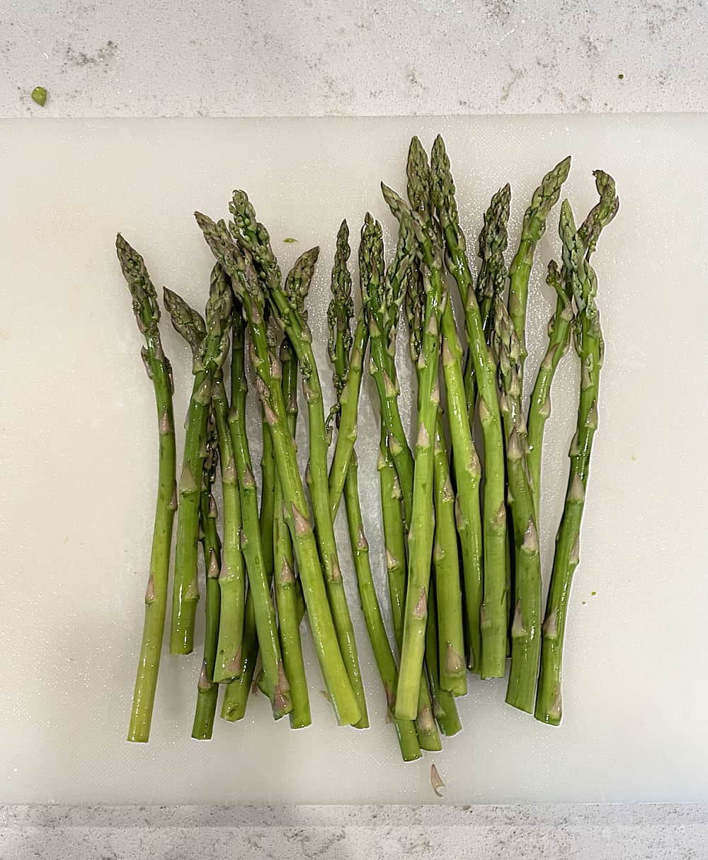 trimmed asparagus on a cutting board