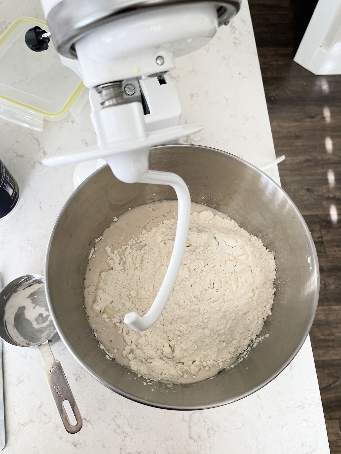 flour being added to kitchen aid for homemade bread