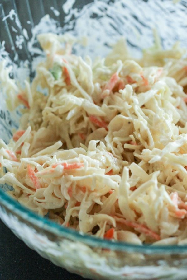 coleslaw in a bowl to put on top of bbq chicken sandwiches