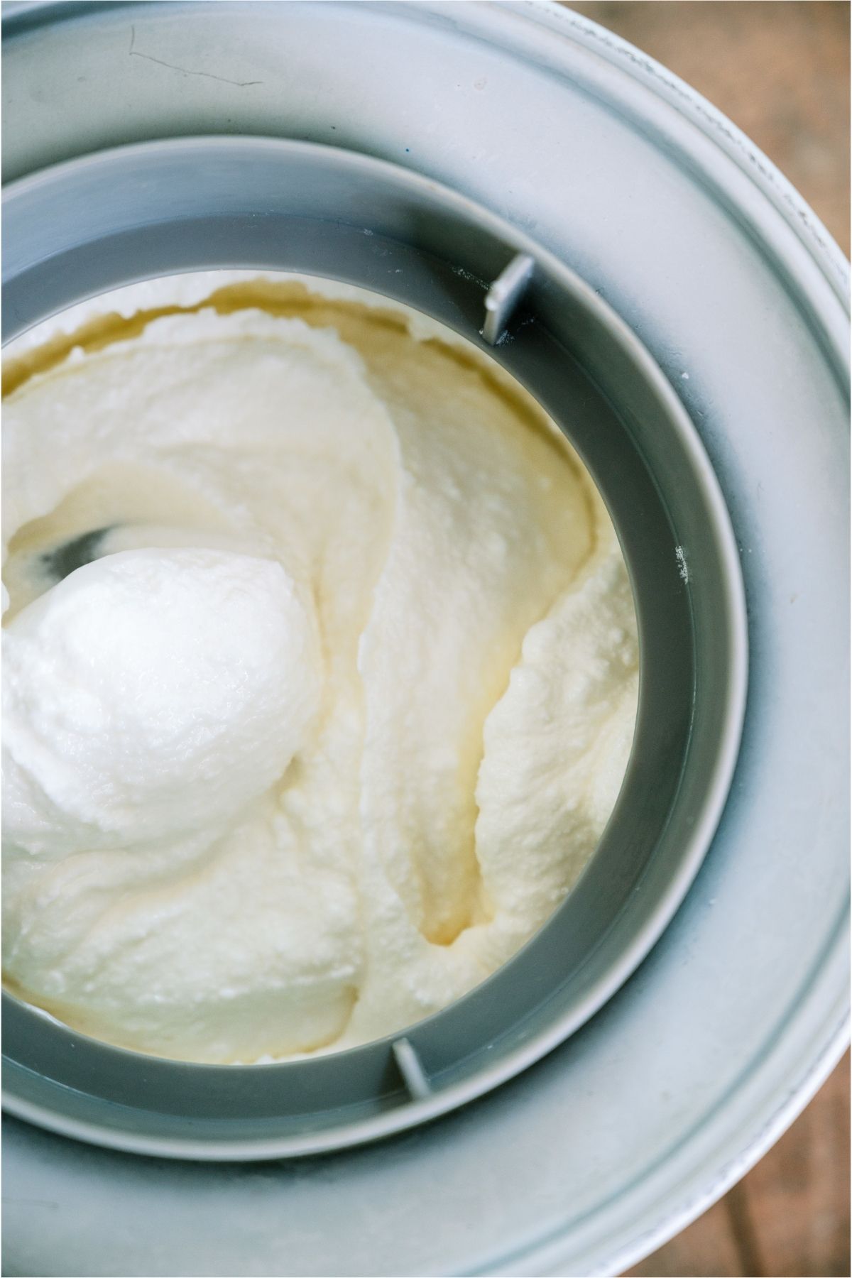 Ice Cream mixture inside ice cream maker.