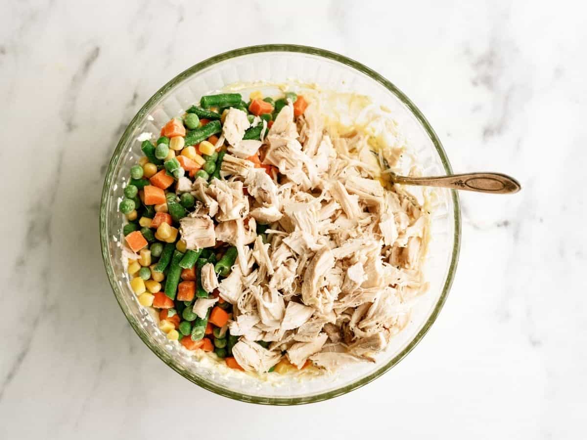 Ingredients for Ritz Cracker Chicken Casserole mixed in a glass bowl