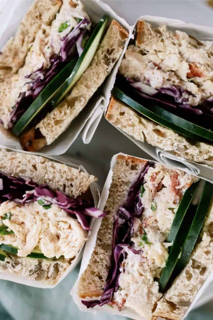 Top view of Chicken Bacon Ranch Sandwiches wrapped in parchment.