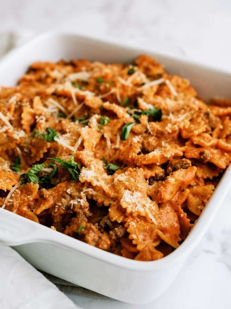 Close up of Instant Pot Ground Beef Lazy Lasagna in a white serving dish.