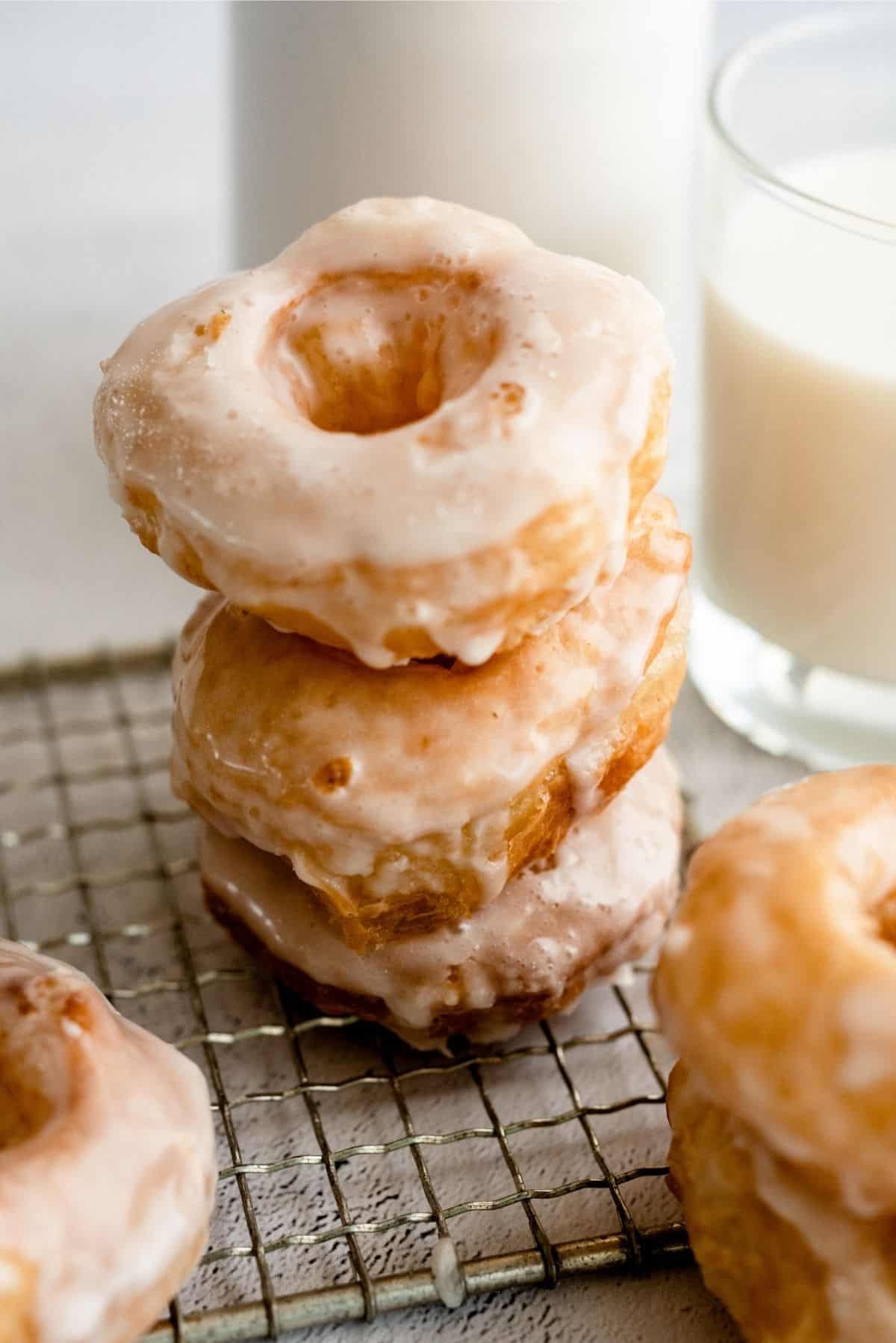 Puff Pastry Donuts dipped in glaze on cooling rack