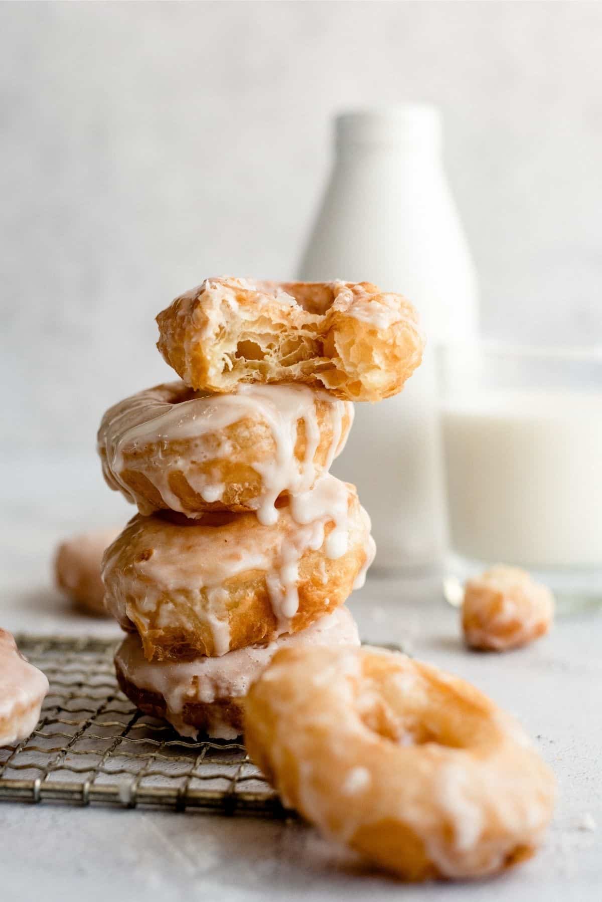 Puff Pastry Donuts stacked on cooling rack