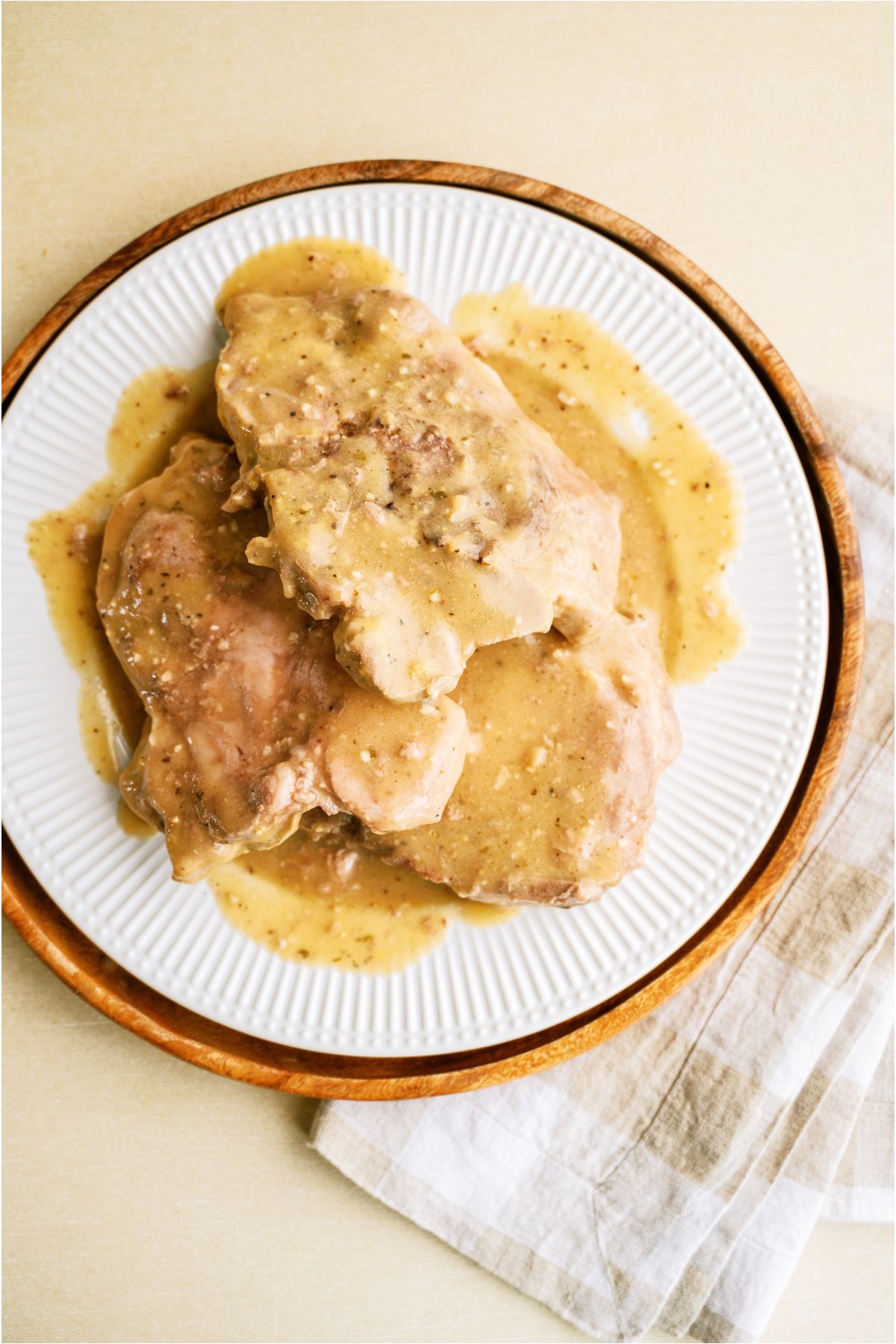 Top view of a plate of Slow Cooker Pork Chops (5 Ingredients).