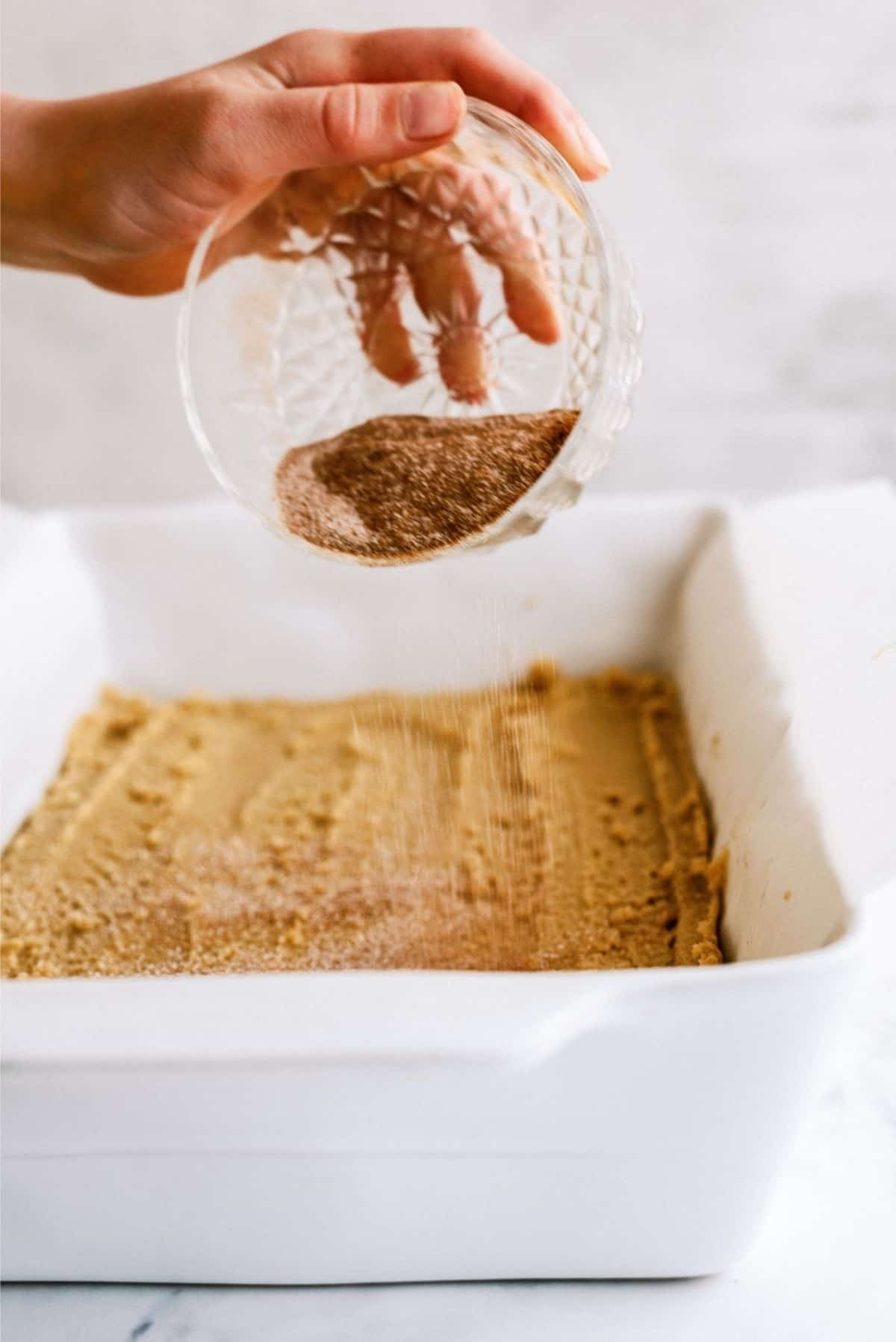 Sprinkle cinnamon mixture over Unbaked Snickerdoodle Blondies