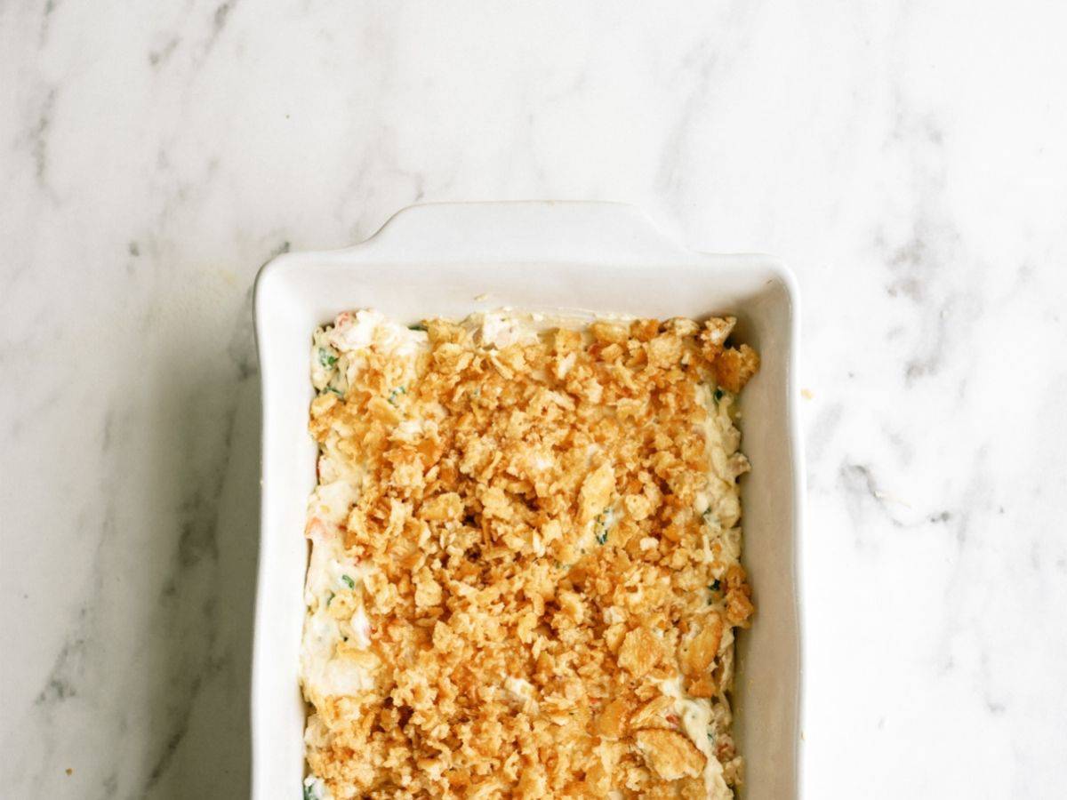 Unbaked Ritz Cracker Chicken Casserole in a casserole dish