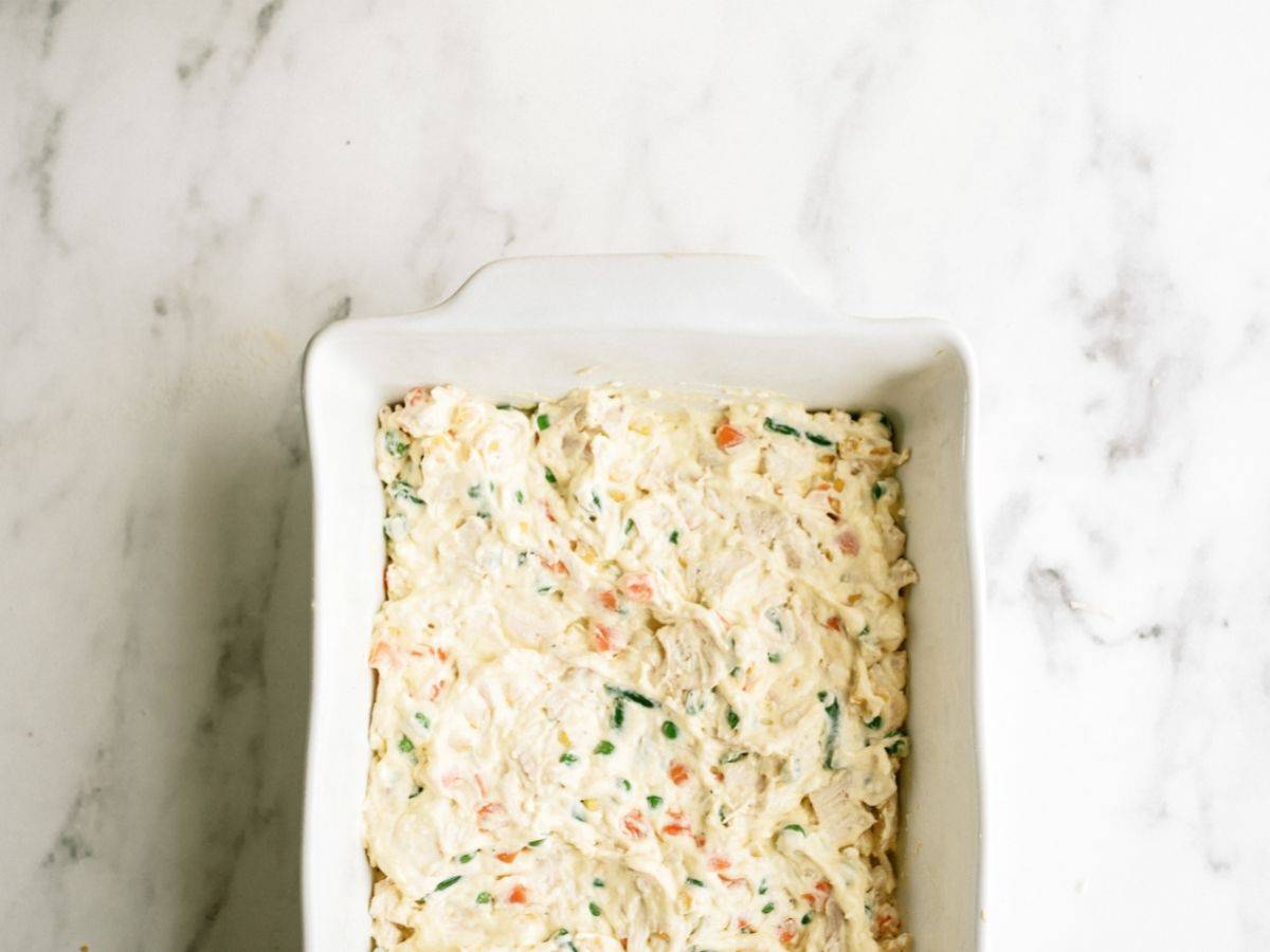 Unbaked Ritz Cracker Chicken Casserole in a casserole dish