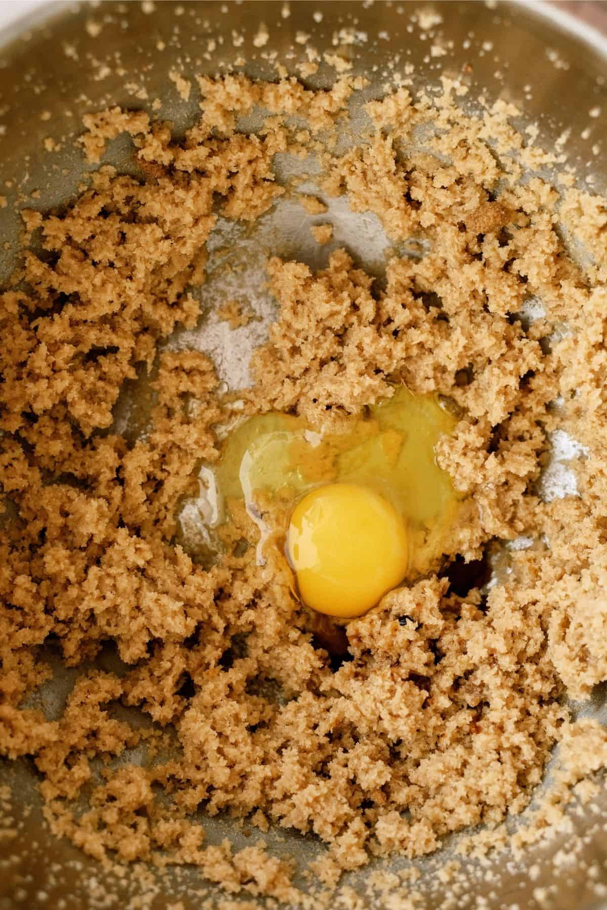 Adding eggs to cream mixture