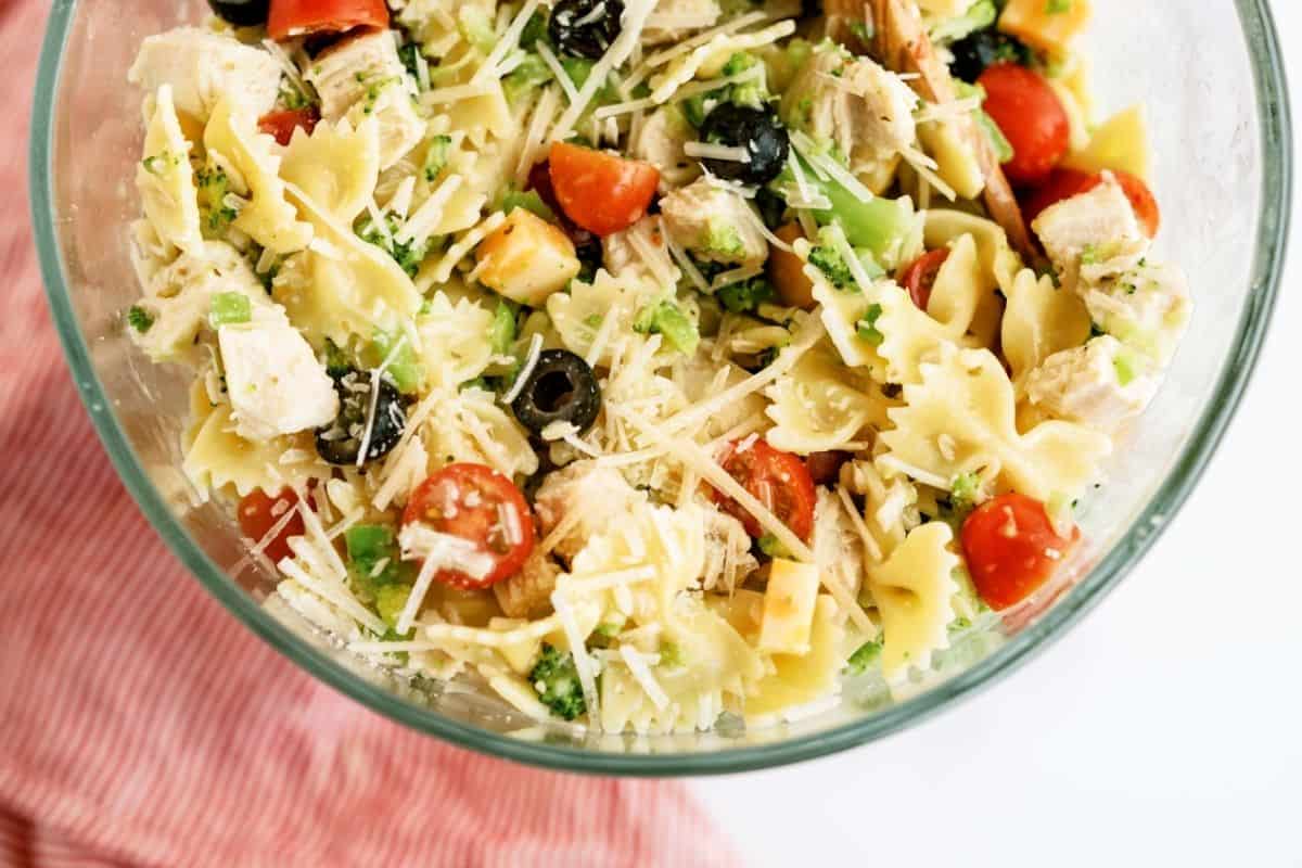 Grilled Chicken Bow Tie Pasta Salad mixed in a glass bowl