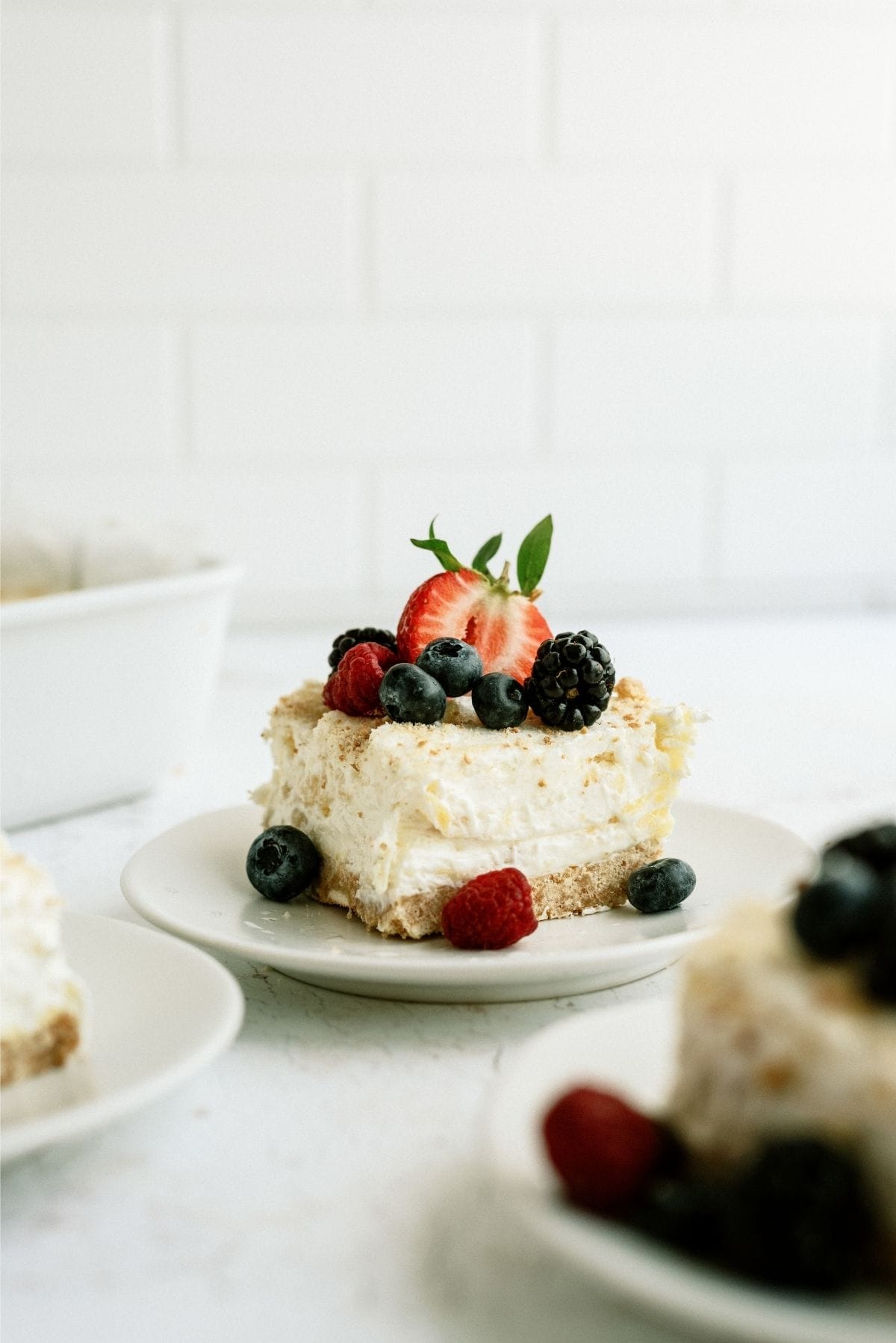 Slice of Fluffy Cream Cheese Dessert on a white plate