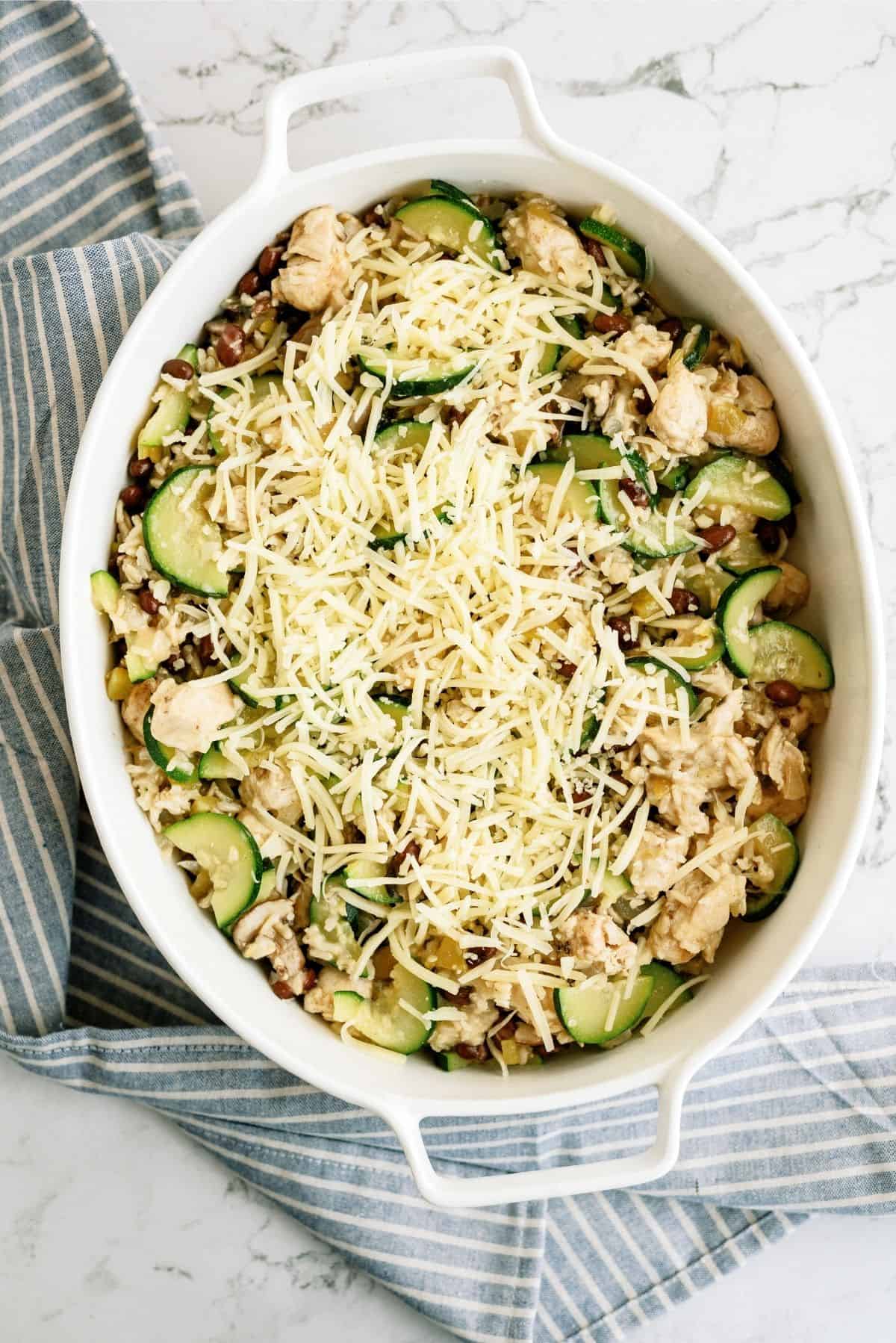 Unbaked Chicken and Black Bean Casserole in a white casserole dish