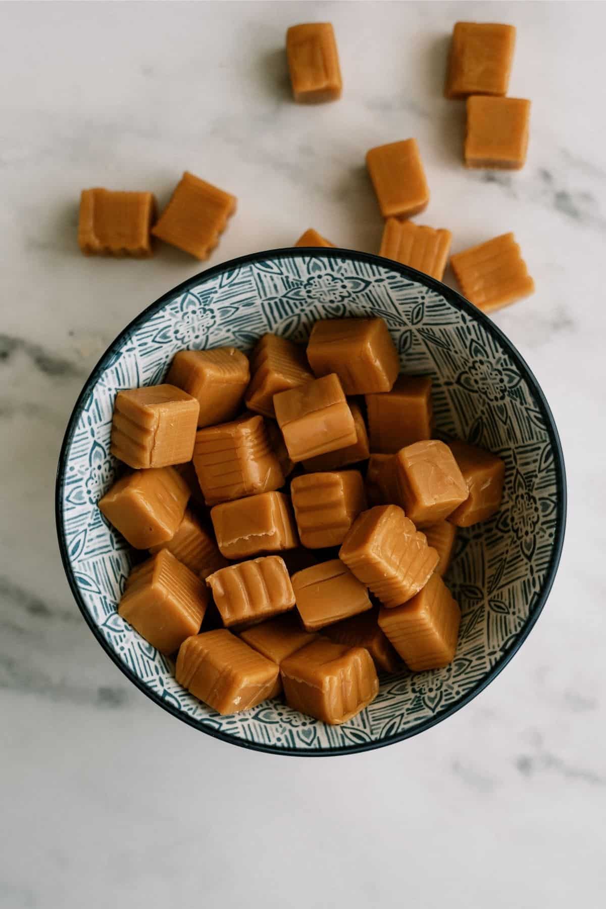 Unwrapped caramels in a bowl