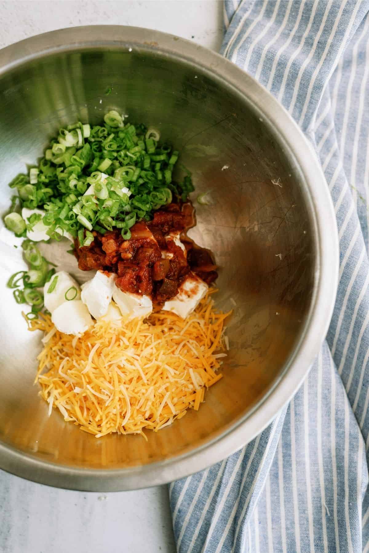 Chicken taco ingredients in metal bowl