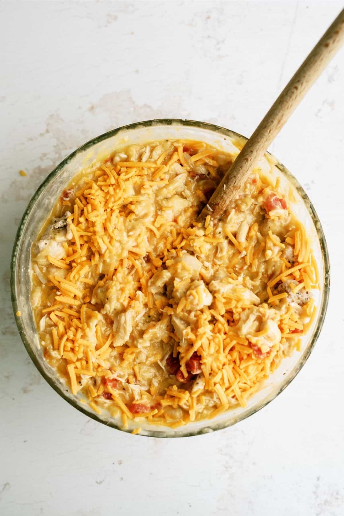 Creamy casserole ingredients in a glass mixing bowl