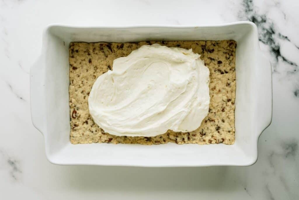 Whip cream mixture spread over crust.