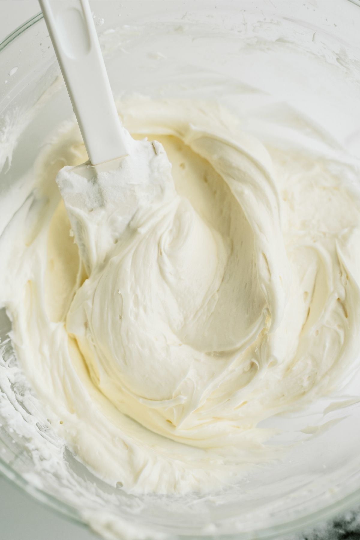 Folding whip cream into cream cheese mixture