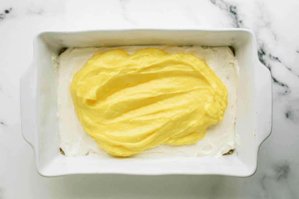 Lemon pudding mixture spread on top of cool whip layer.