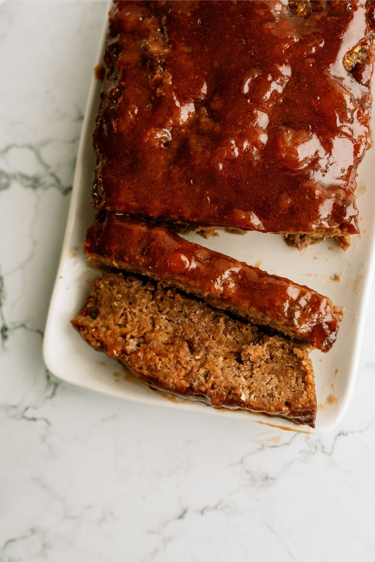 Sweet and Tangy Meatloaf sliced on a serving platter
