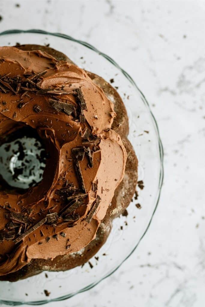 Top view of Triple Chocolate Bundt Cake frosted with sprinkles.