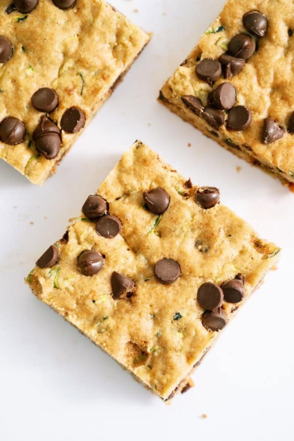 3 Chocolate Chip Zucchini Bars on a white background.