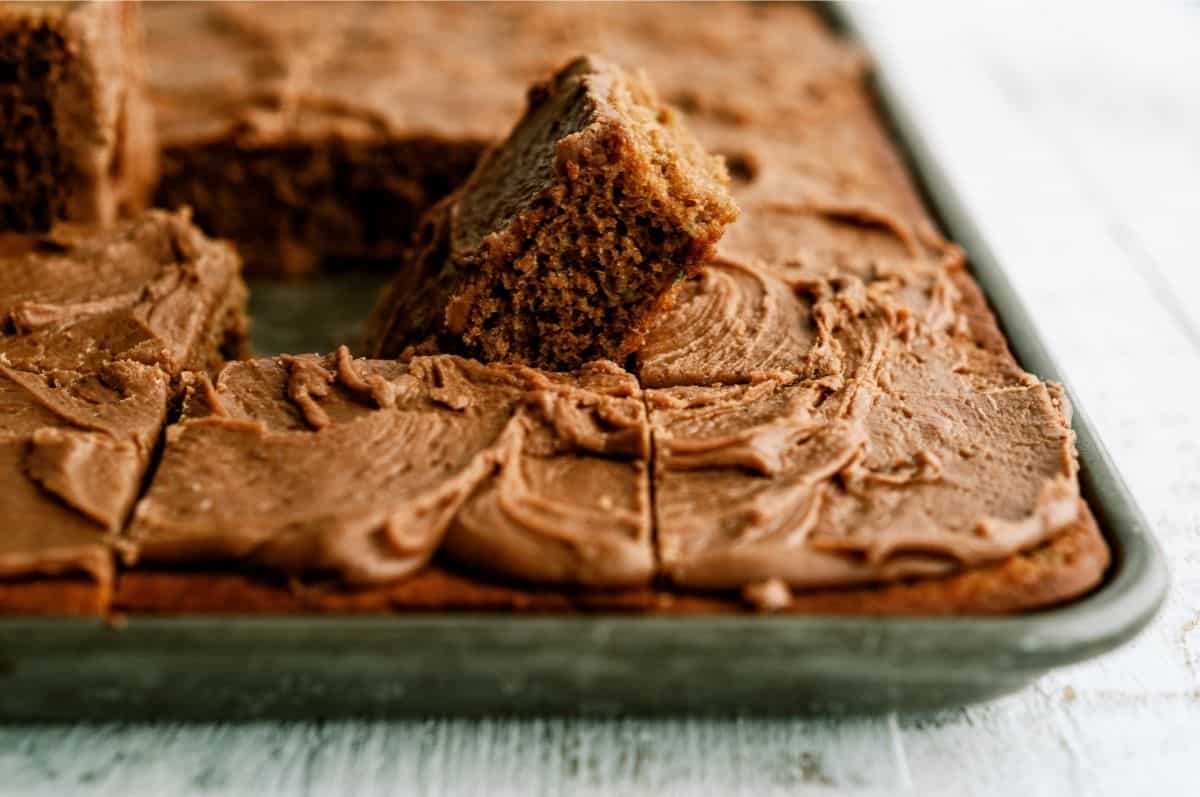 Chocolate Zucchini Sheet Cake frosted in a sheet pan