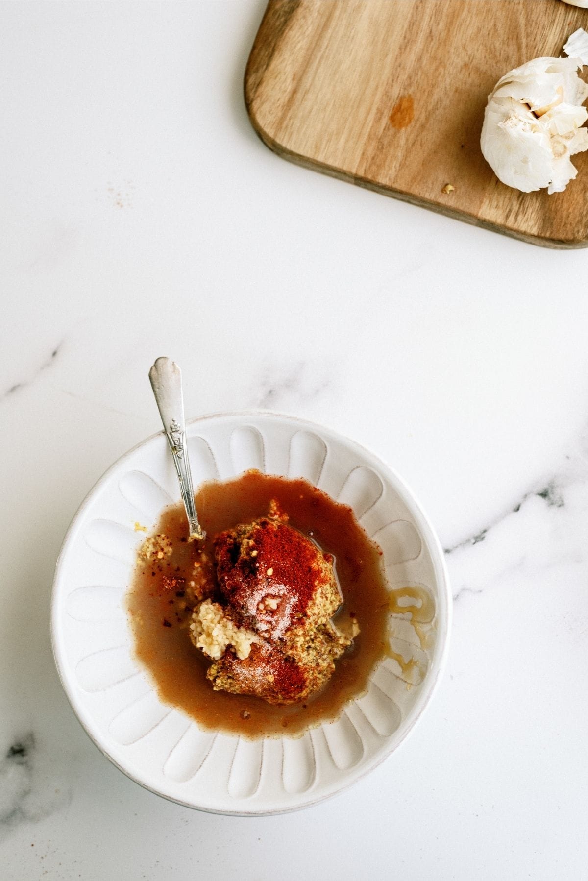 Sauce being mixed in a bowl for Grilled Honey Mustard Chicken