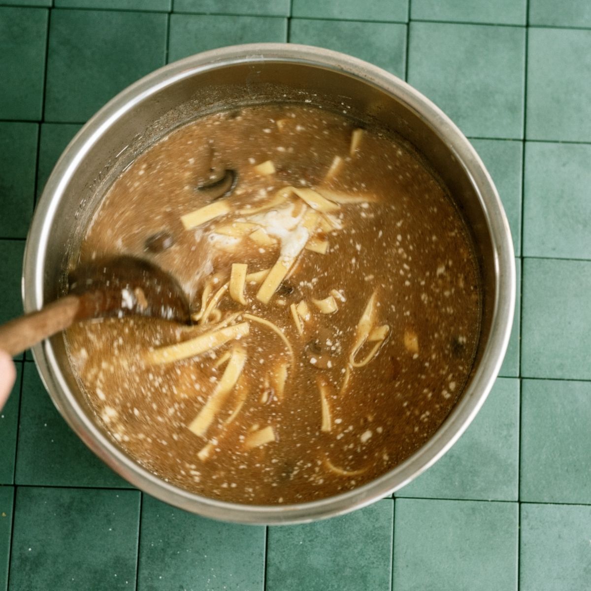 All ingredients for Instant Pot Beef Stroganoff Soup mixed together in the Instant Pot