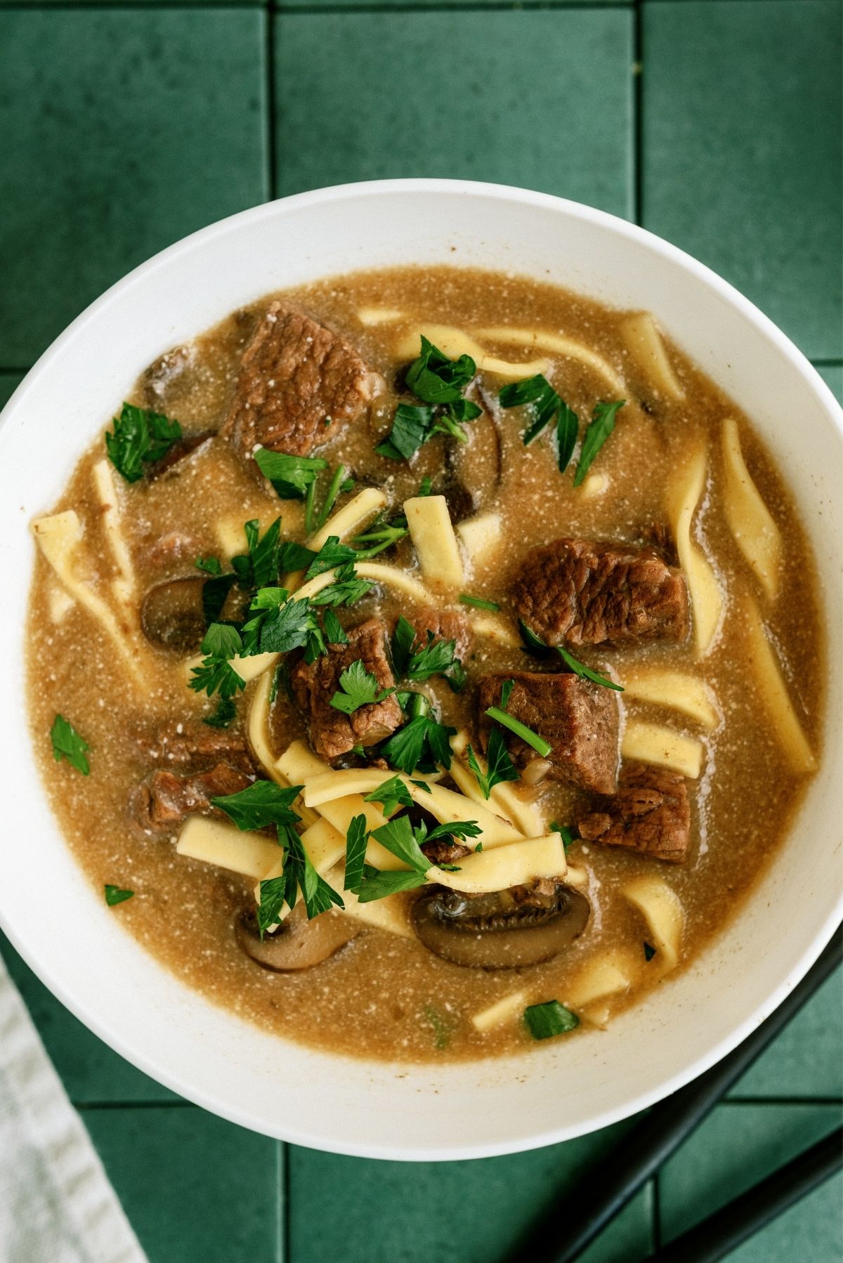 Instant Pot Beef Stroganoff Soup in a white bowl