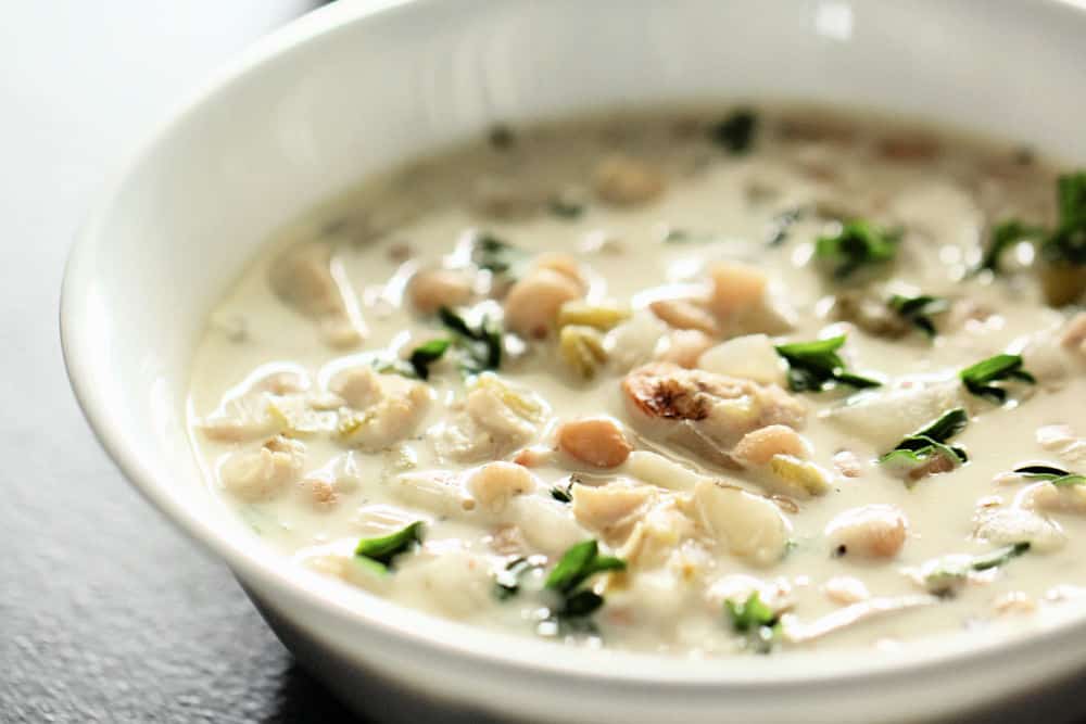 creamy white chicken chili made in the Instant Pot in a white bowl