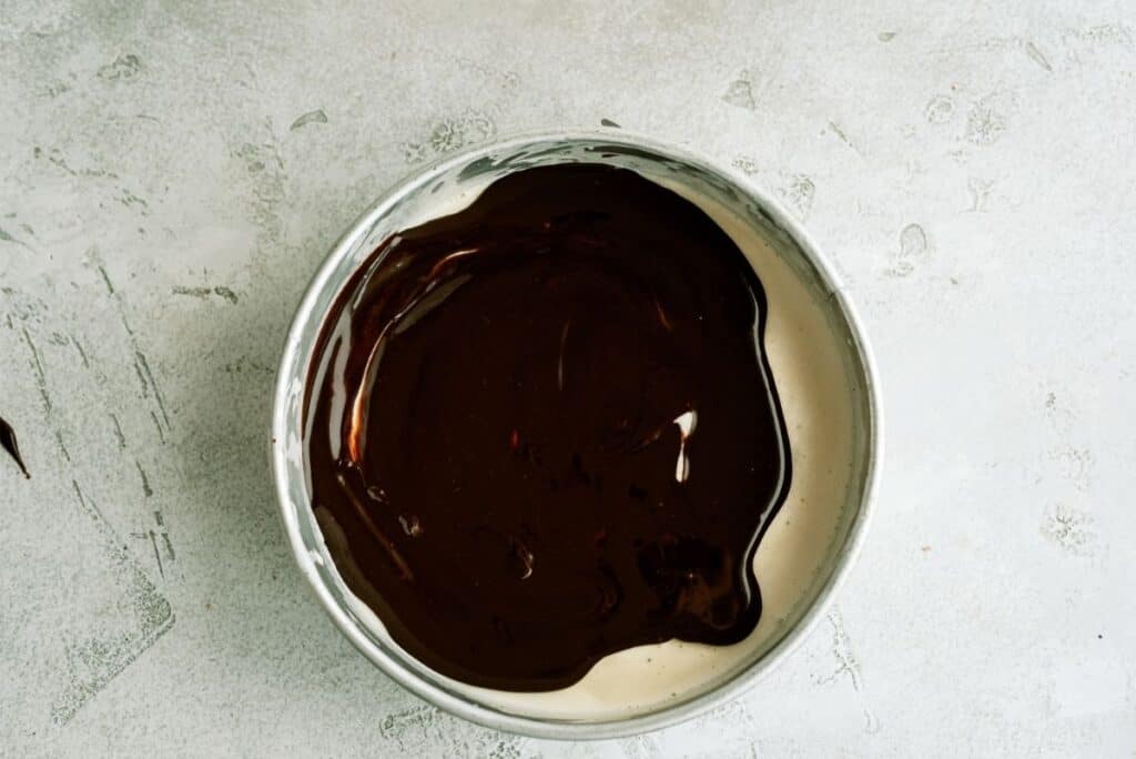Fudge topping poured on top of ice cream layer.