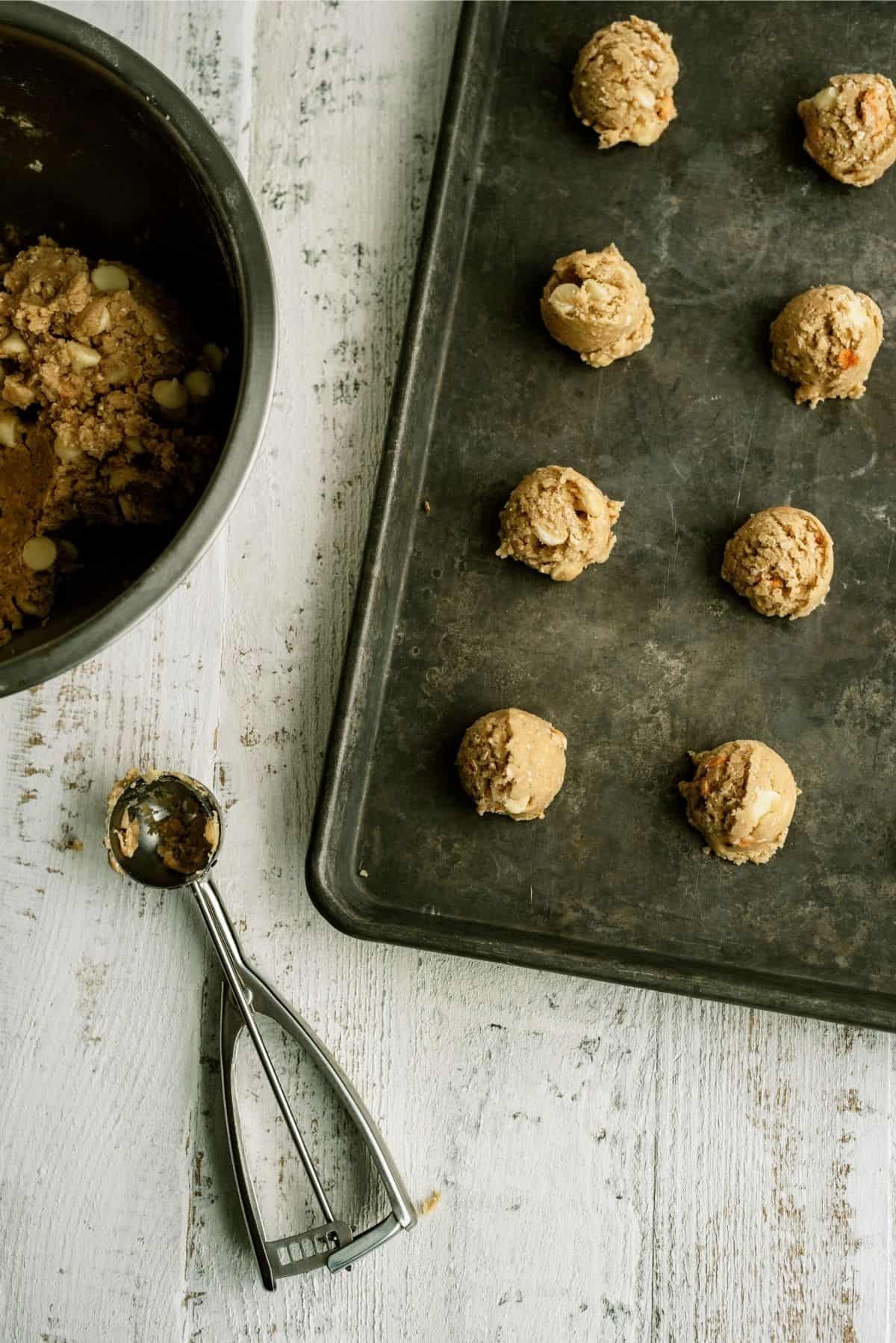 Cookie dough balls on cookie sheet ready to bake