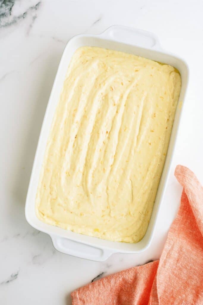 Pineapple Orange Cake better in a white baking dish.